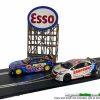 Esso sign in front of some cars for scale